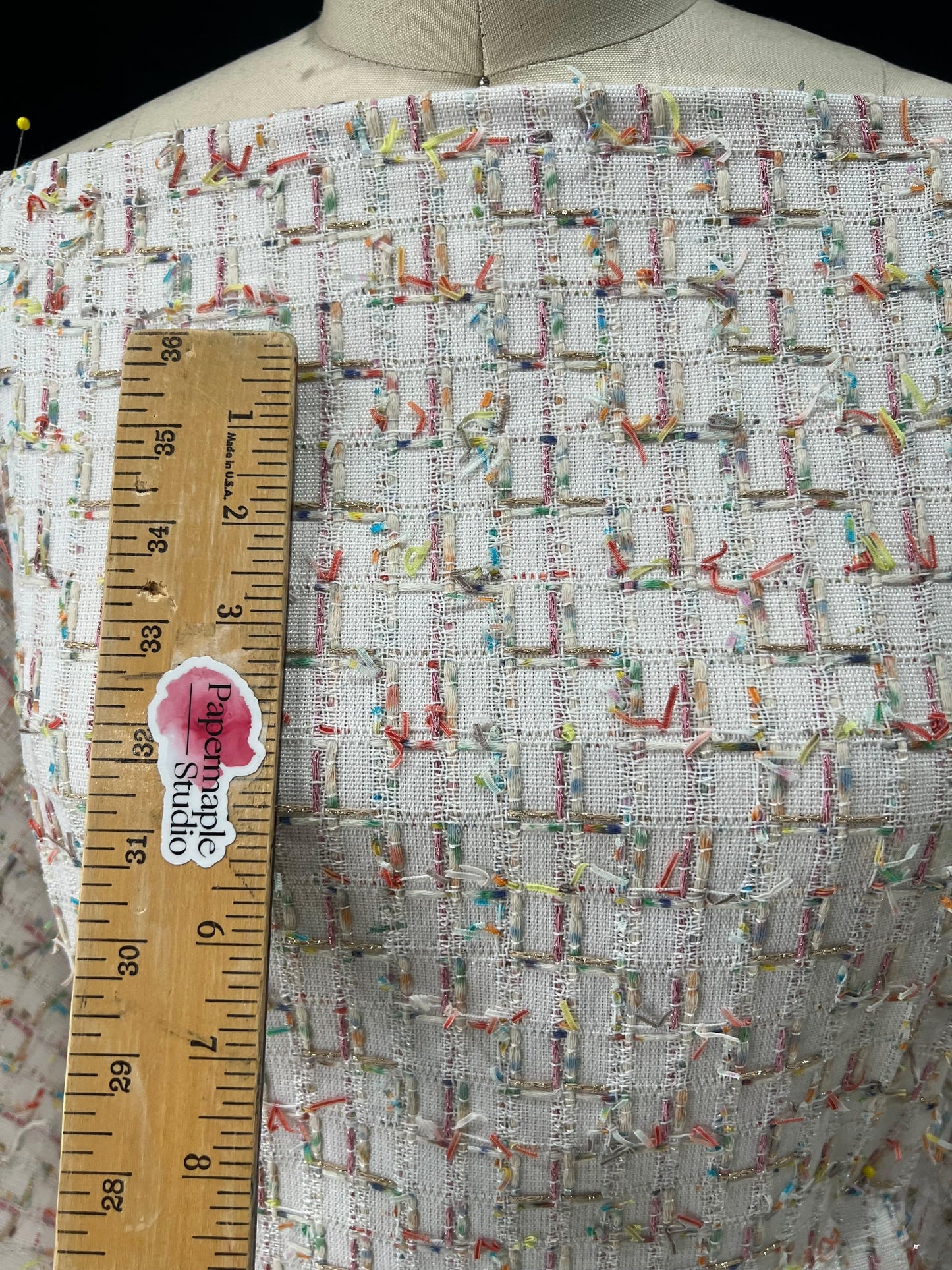 White cream metallic pink gold and multicolored couture boucle fabric by Papermaple Studio, featuring textured, shimmering woven fibers.